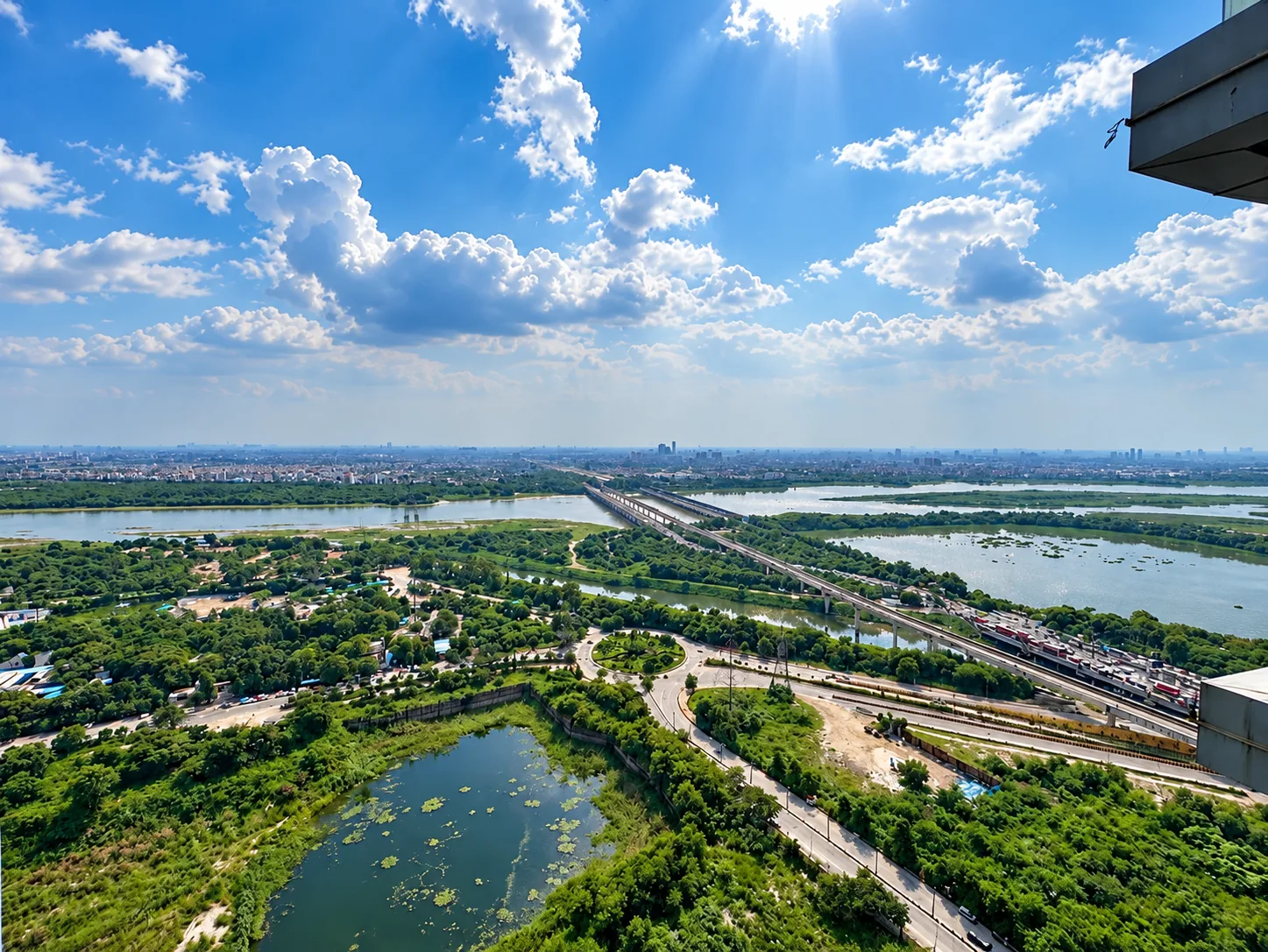 Yamuna river and city view from a high floor balcony at Mulberry Homes, Supernova Spira Noida