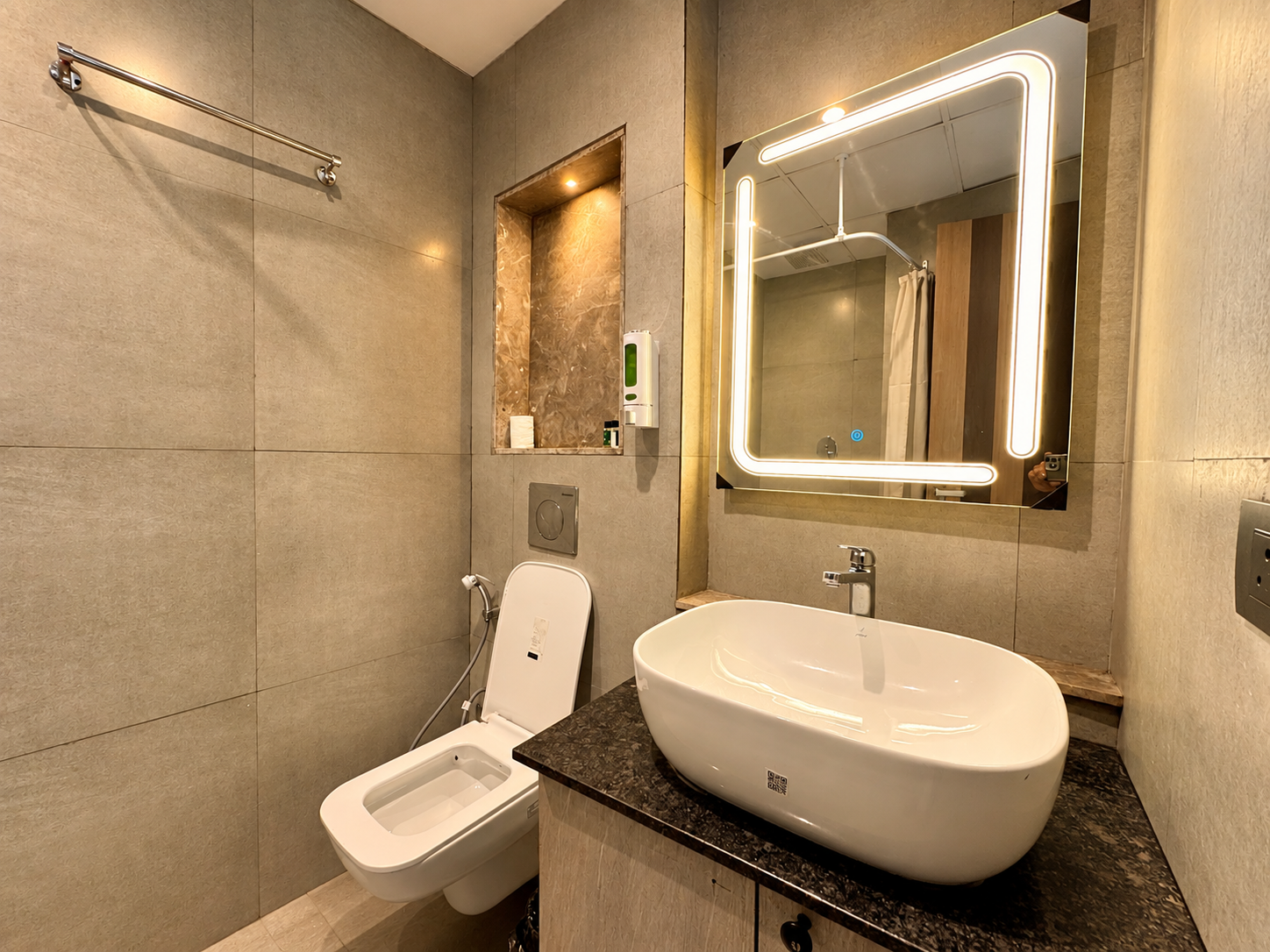 Hotel-style bathroom with LED mirror and vessel sink at Panorama Balcony 32, Supernova Noida