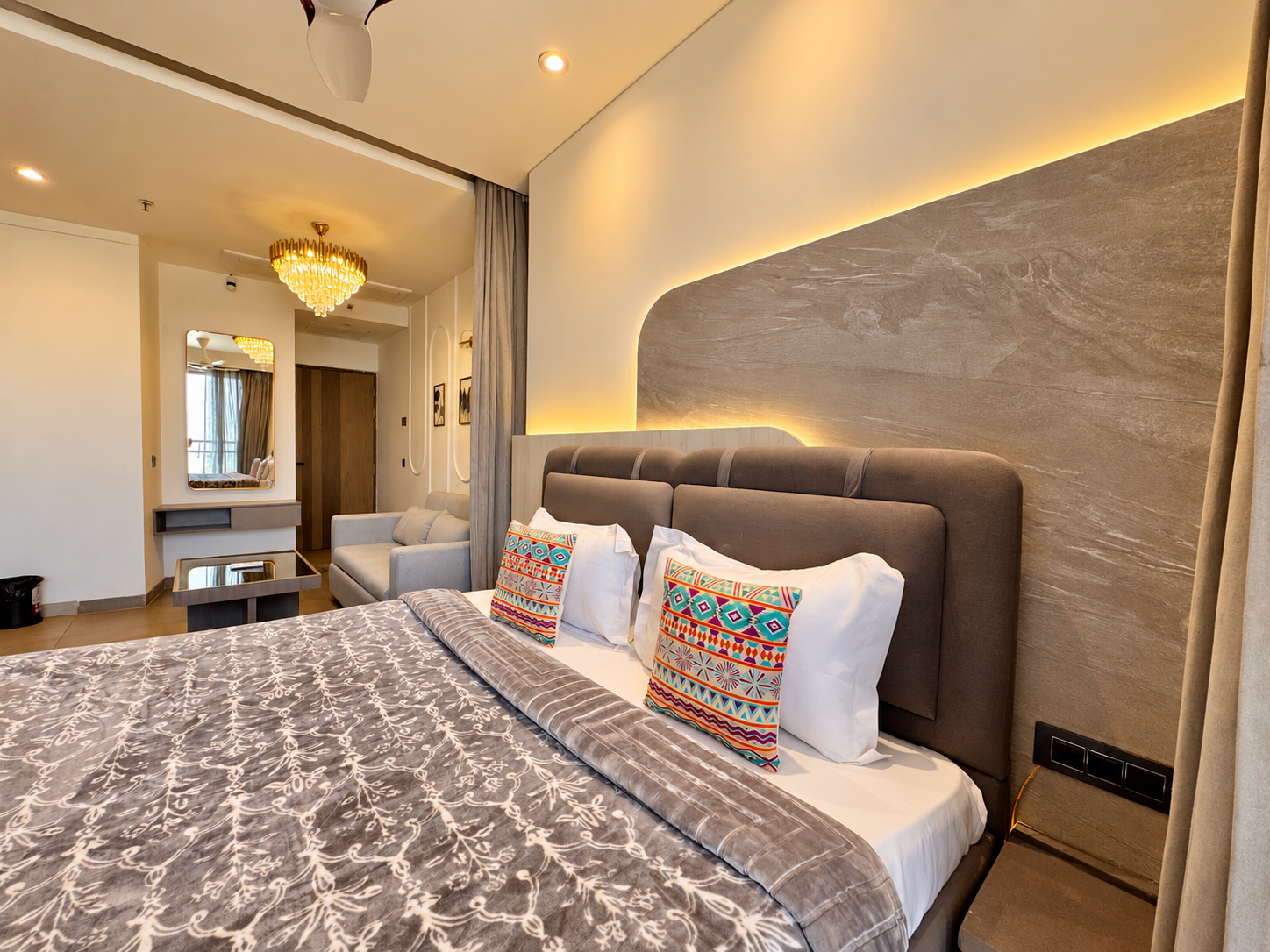 Boutique headboard bedroom with colourful pillows at Panorama Balcony 32, stay in Supernova Noida
