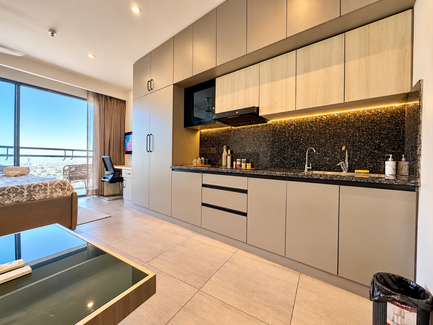Modular kitchenette with balcony city view at Panorama Balcony 32, Supernova Spira Airbnb in Noida