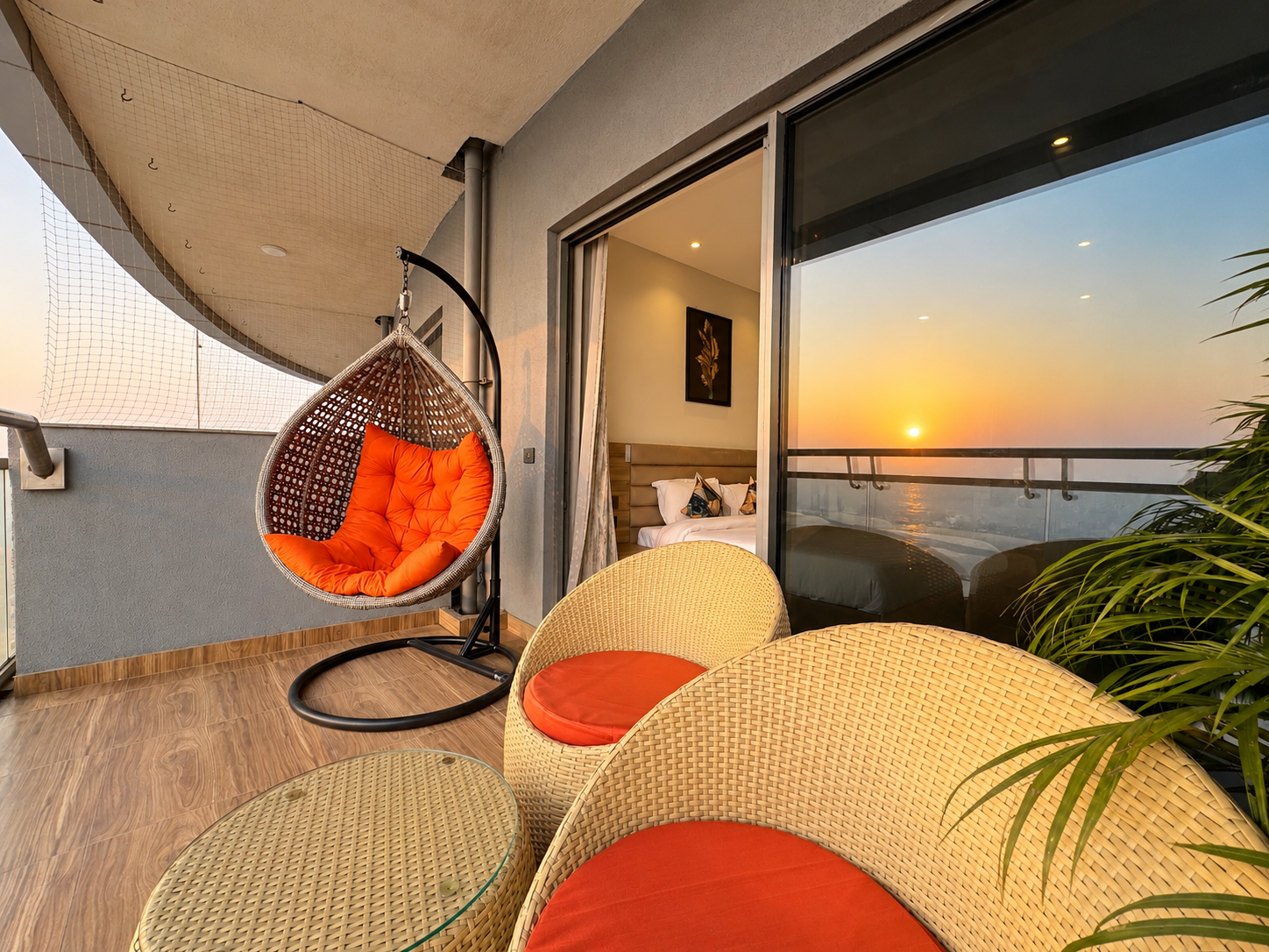 Sunset over the Yamuna from the balcony swing chair at RiverCrest 39, floor 39 of Supernova Spira, Noida
