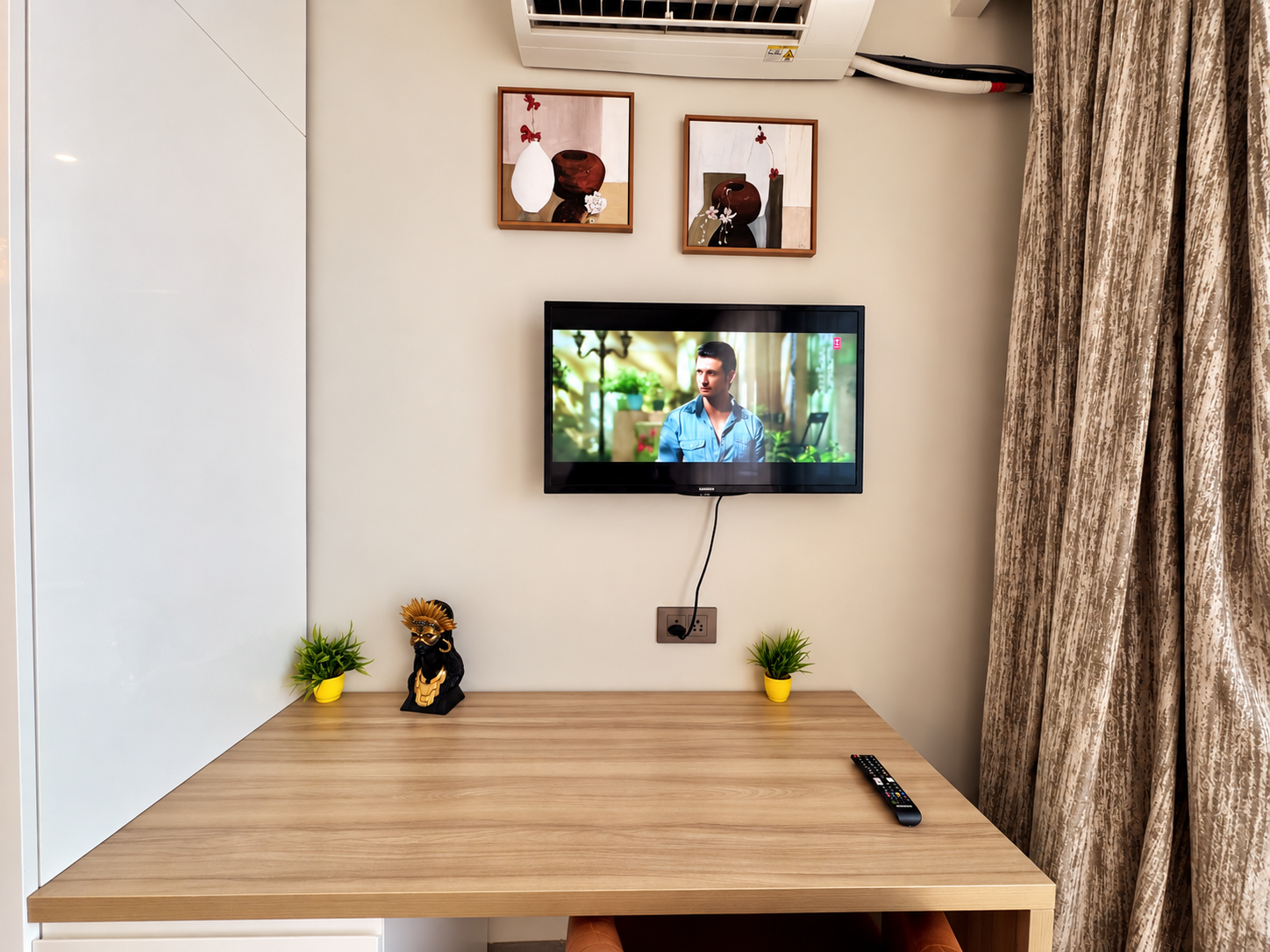 Work desk and TV wall at RiverCrest 39, Supernova room price from ₹3,500