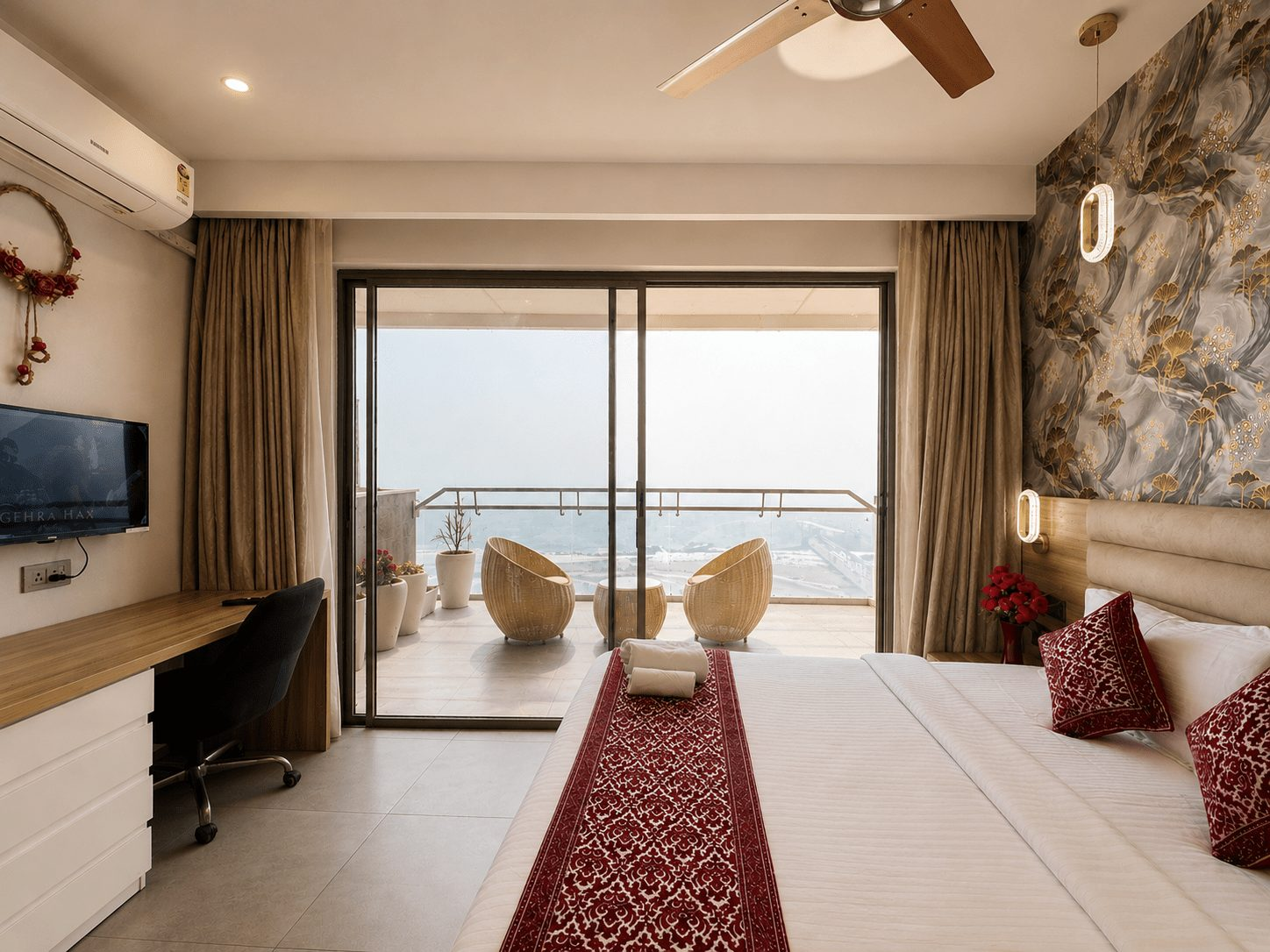 Bedroom with red runner and balcony seating at UrbanAura Studio 37, supernova spira room booking