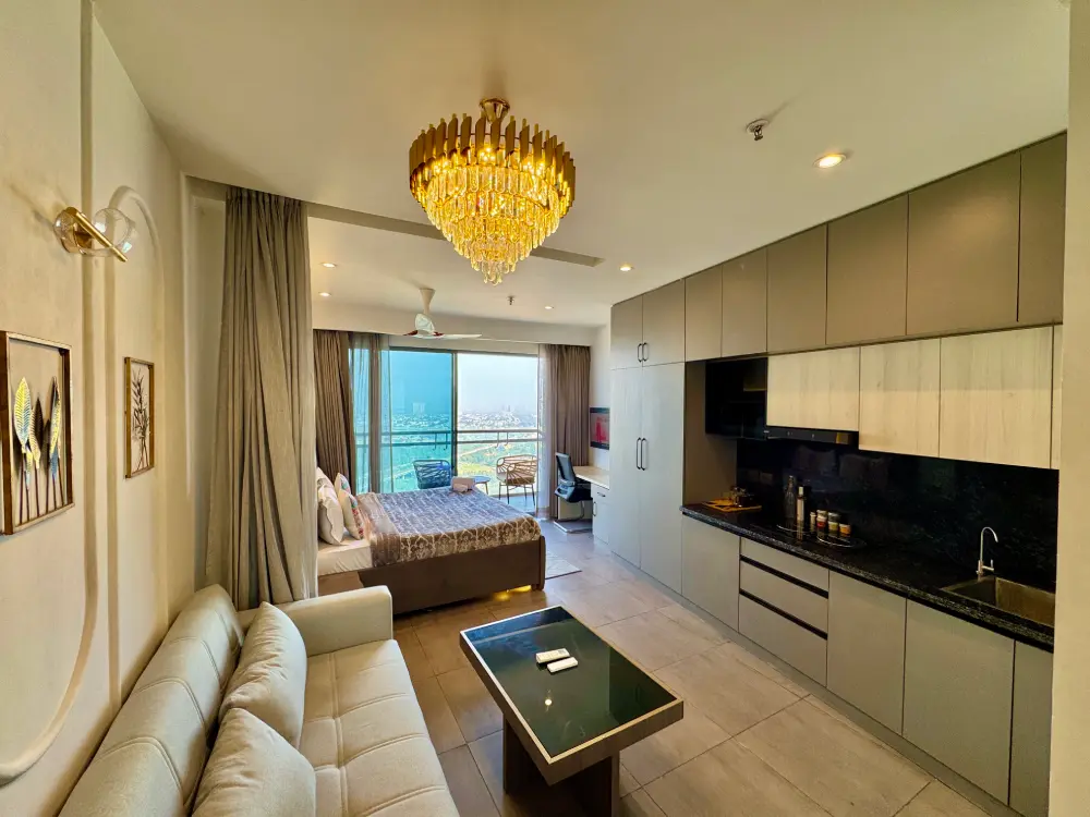 bedroom with wooden headboard at Panorama 32 Supernova Noida