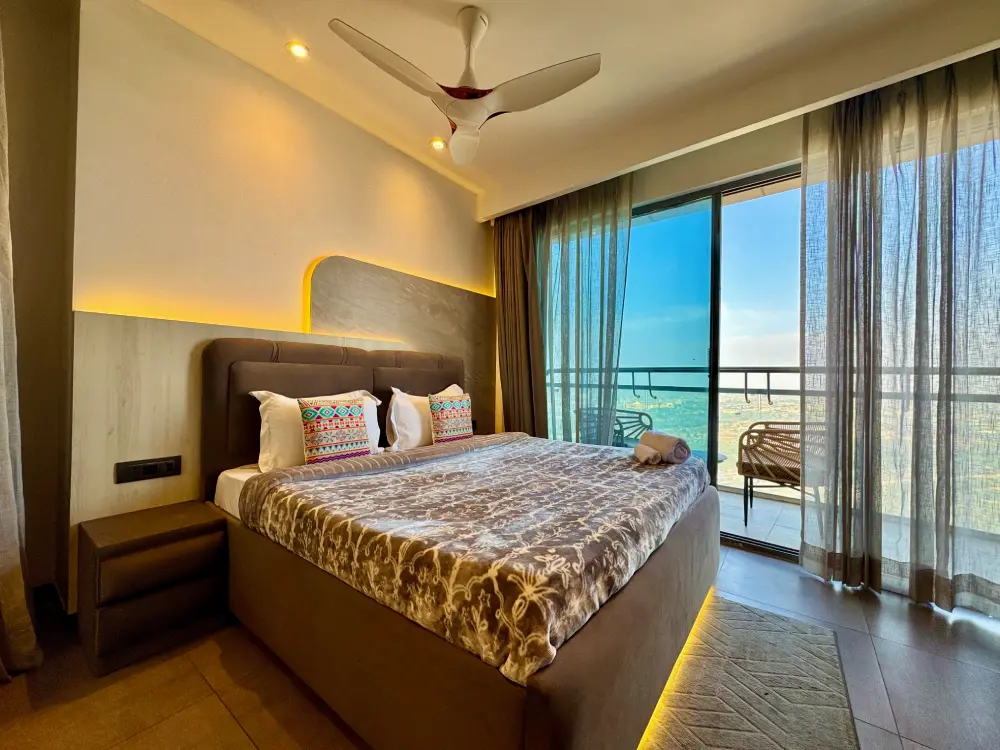 modern bedroom with river window at Panorama 32 Supernova Noida