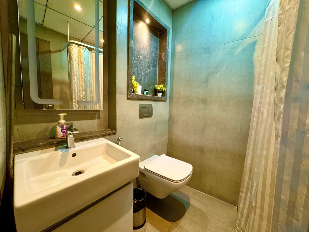 Bathroom with vanity and sink at Mulberry Homes Supernova Noida