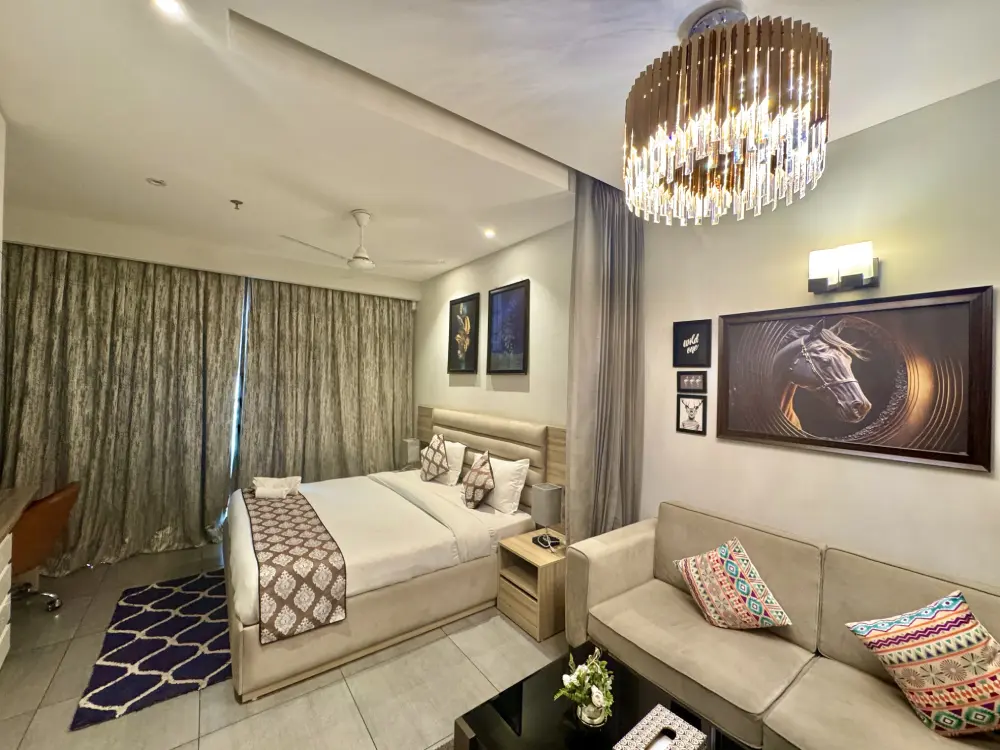 Luxury homestay Noida soft lighting bedroom Supernova Spira