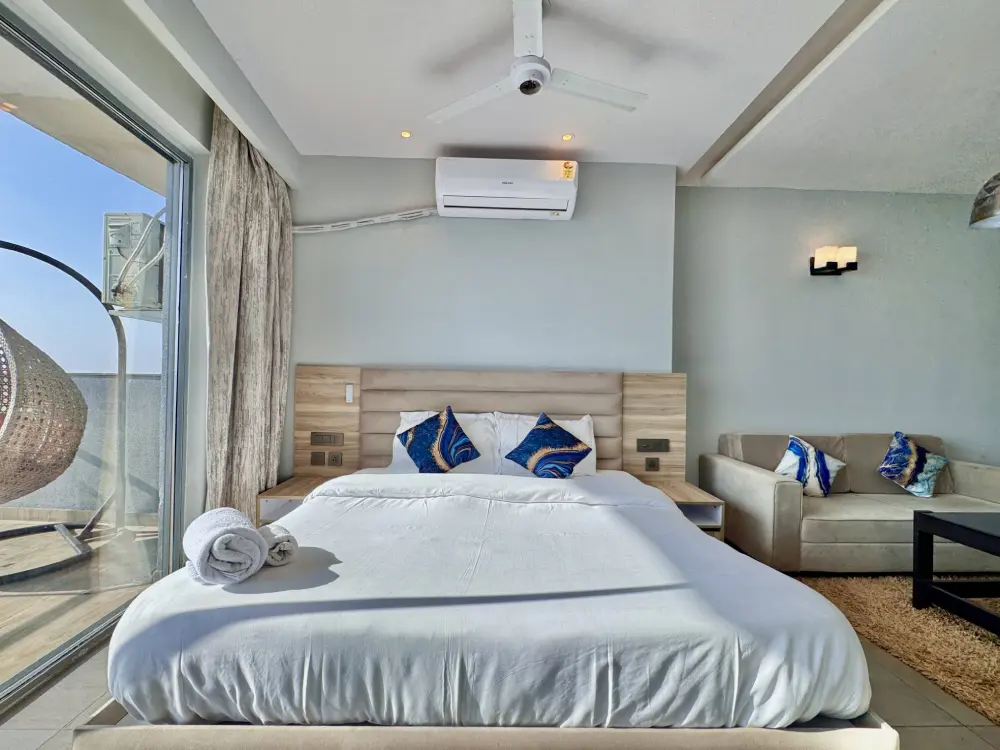Supernova Sector 94 Noida stylish bedroom with blue accents