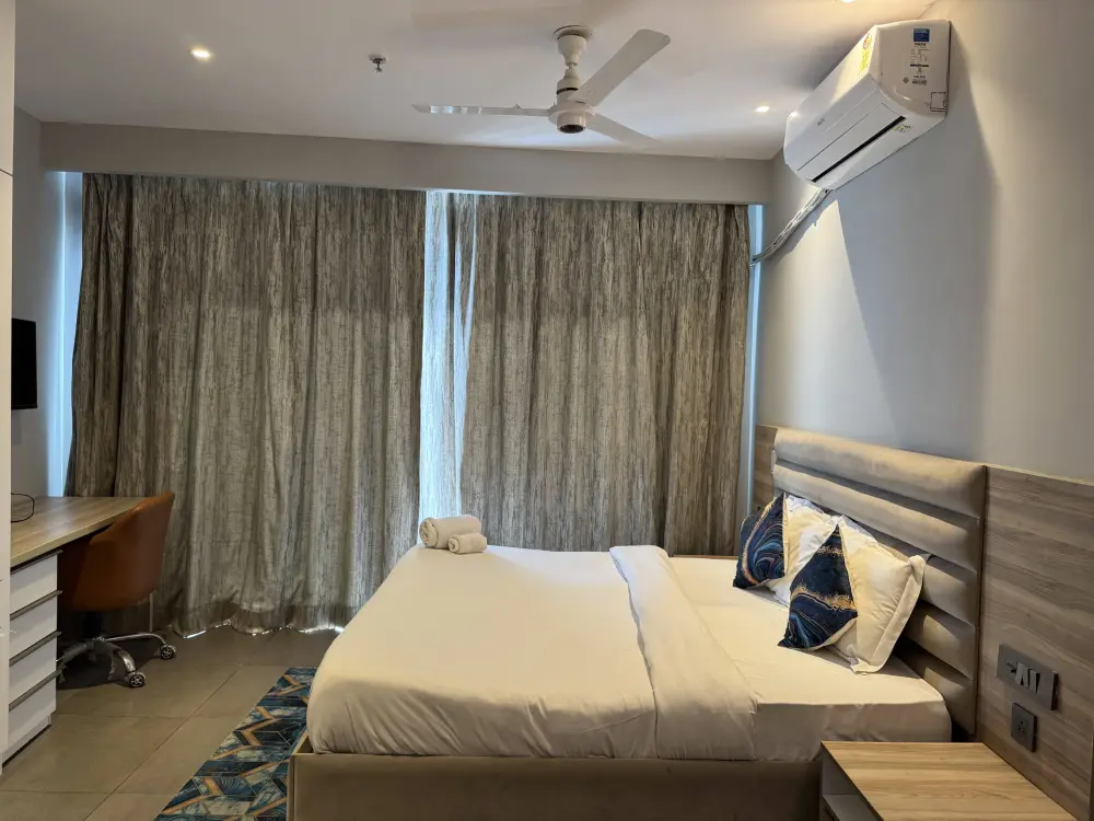 Supernova Spira Noida bedroom with floor-to-ceiling curtains