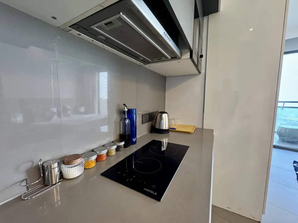 kitchen with range hood at luxury stay Supernova Spira Noida