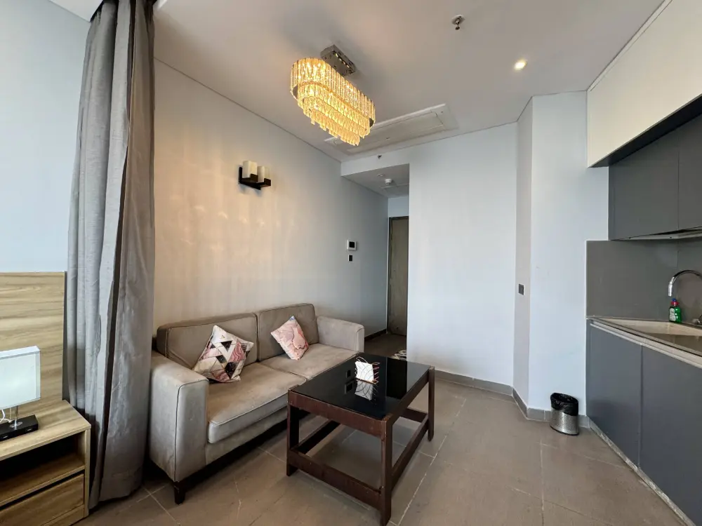 modern kitchen with appliances at Mulberry Homes Supernova Noida