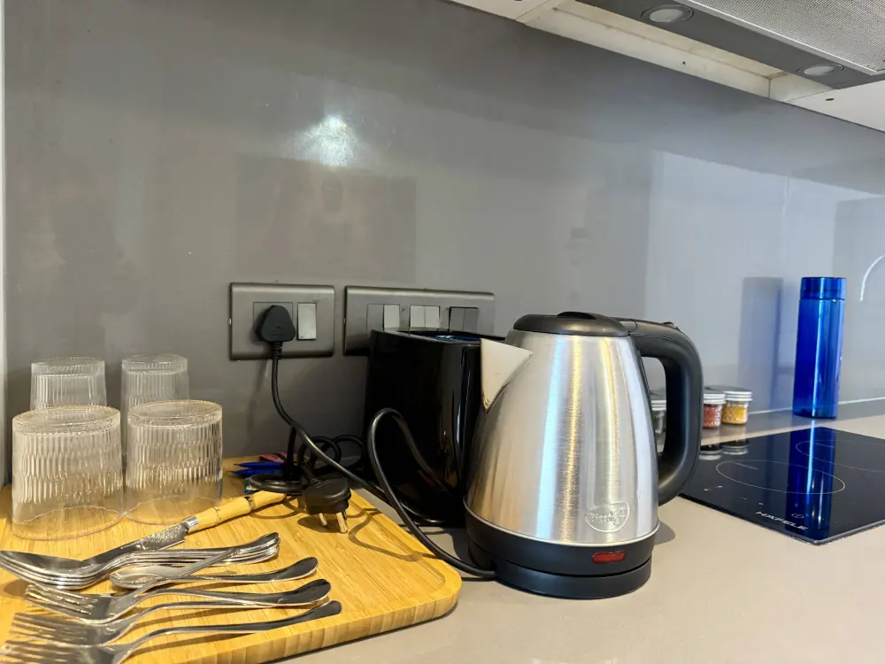 kitchen with electric kettle in CityGlow 28 Mulberry Homes Supernova Noida