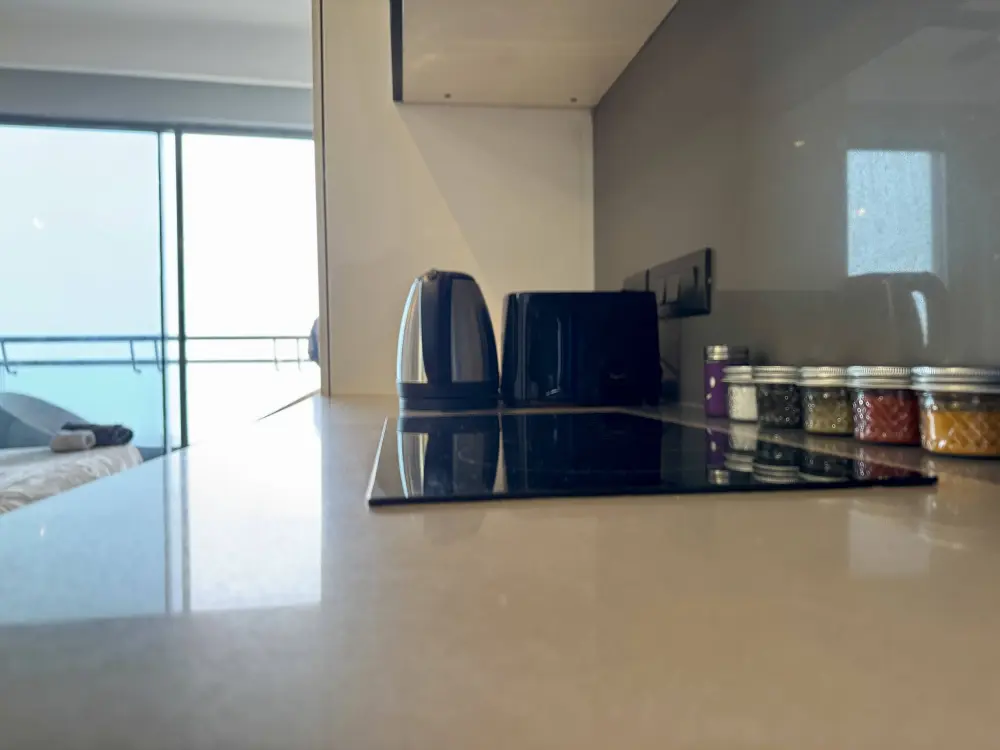 living room with city view in CityGlow 28 Supernova Noida