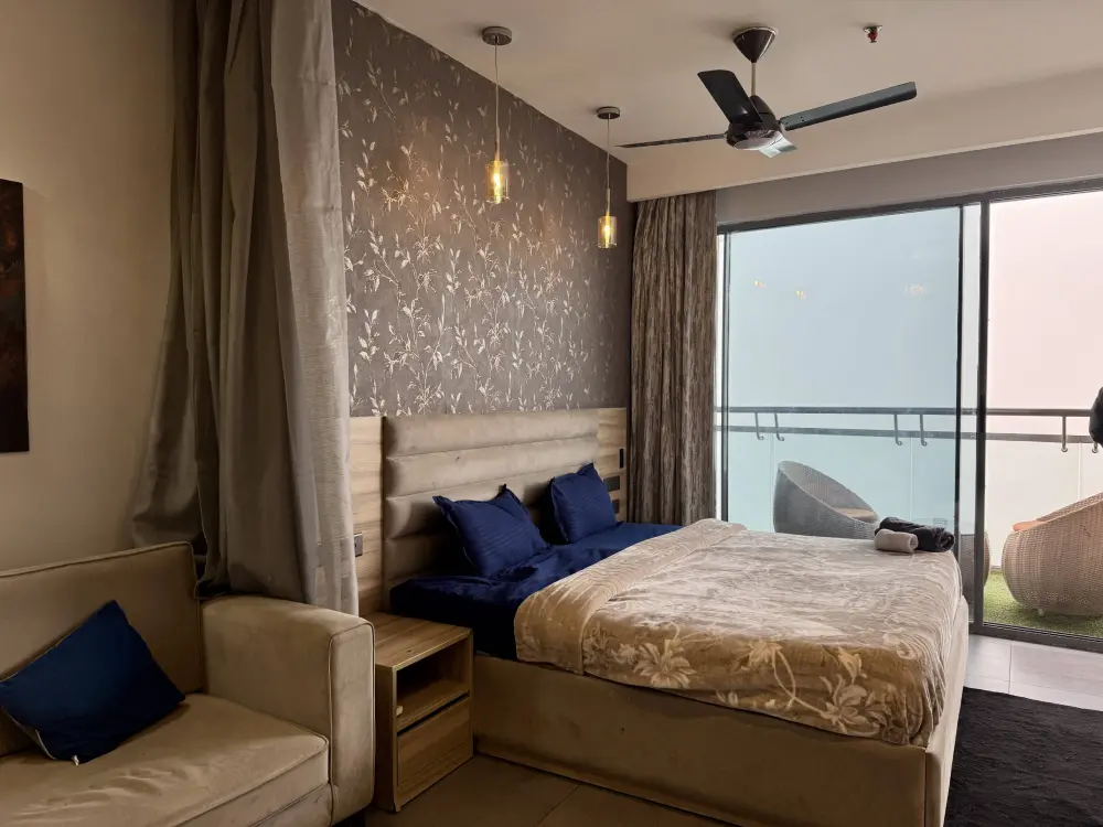 spacious bedroom with balcony access in CityGlow 28 Supernova Spira Noida
