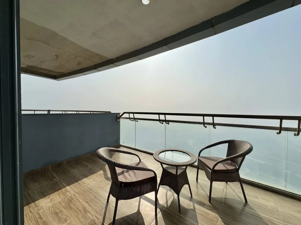 balcony dining area with river view in RiverEase 29 Supernova Noida