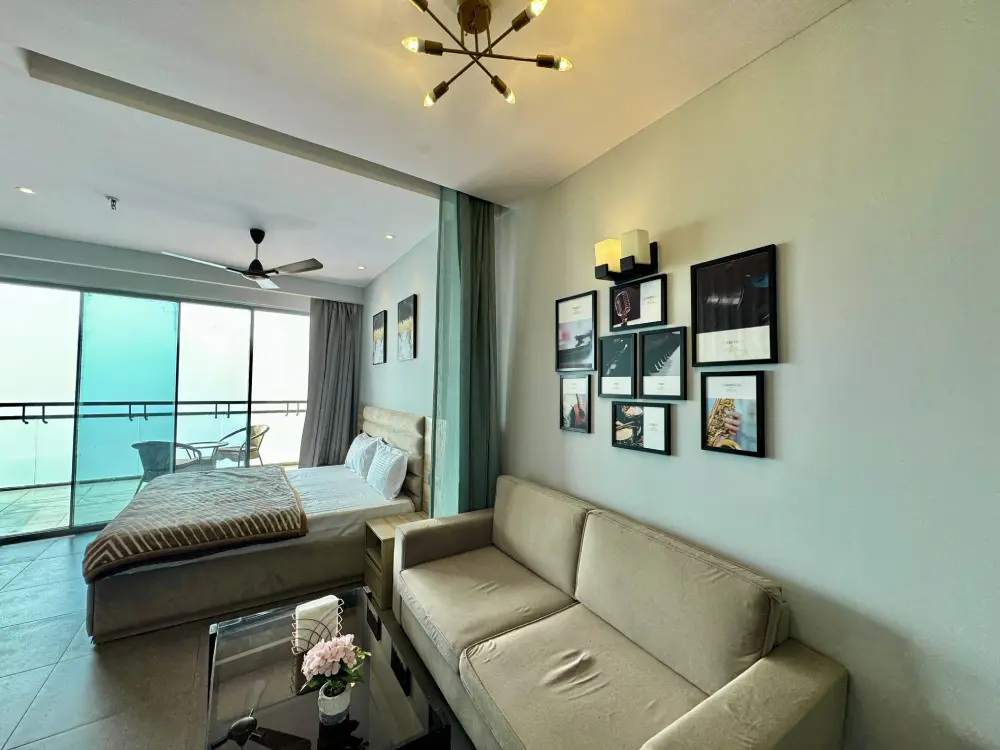 bedroom with ceiling fan and city view in RiverEase 29 Mulberry Homes Noida