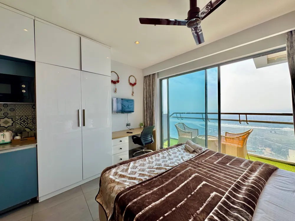 compact bedroom with river view in Eleve 31 Supernova Noida