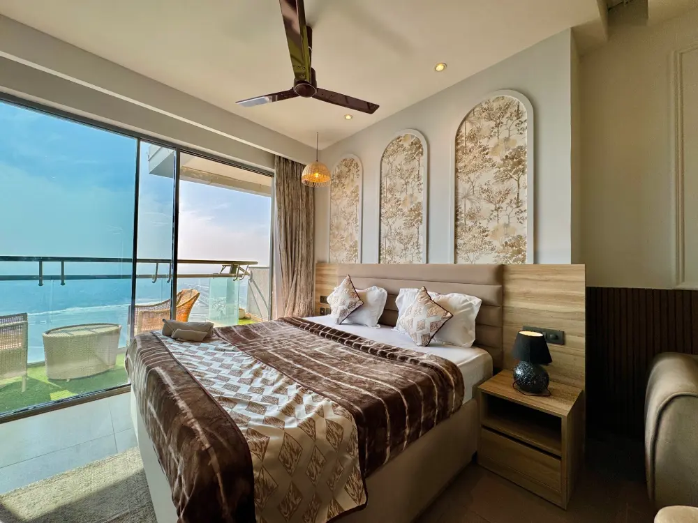 bedroom with open river view window in Eleve 31 Supernova Noida