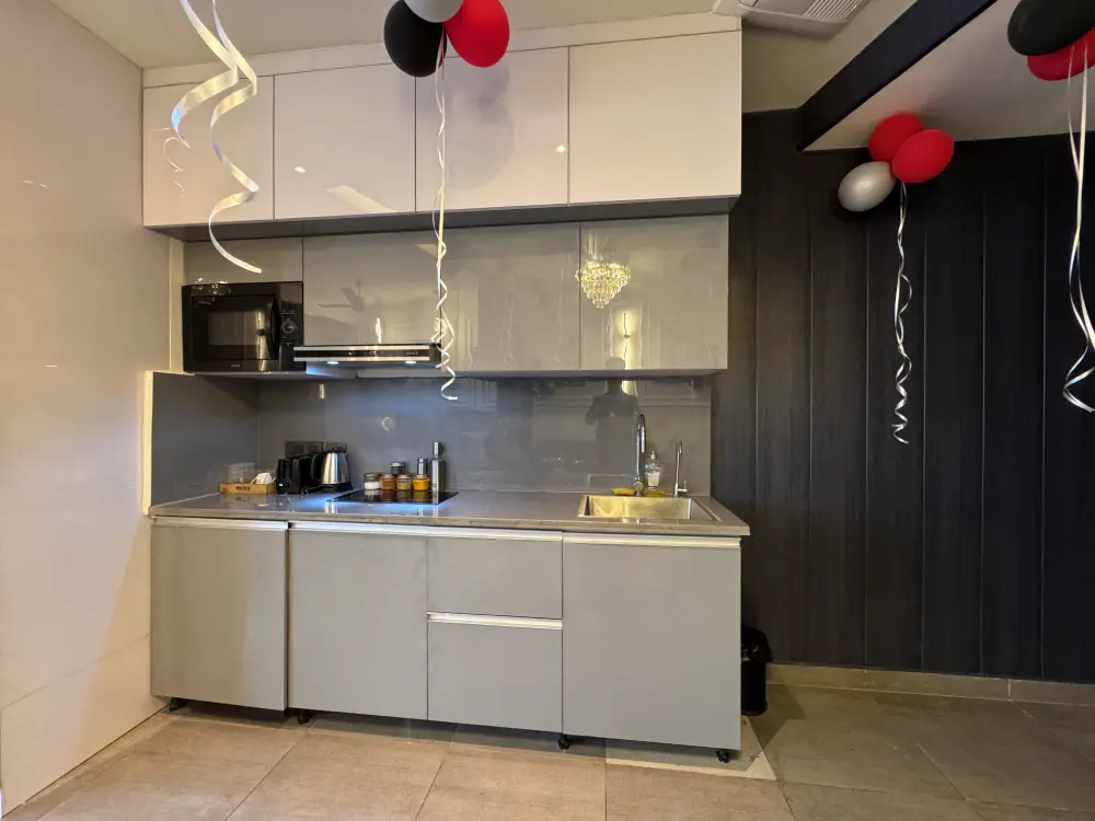 kitchen with dark cabinets in Panorama 32 Mulberry Homes Noida