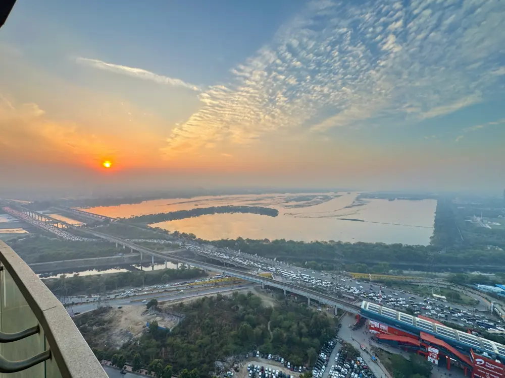 sunset river and skyline view from Panorama 32 Mulberry Homes Noida