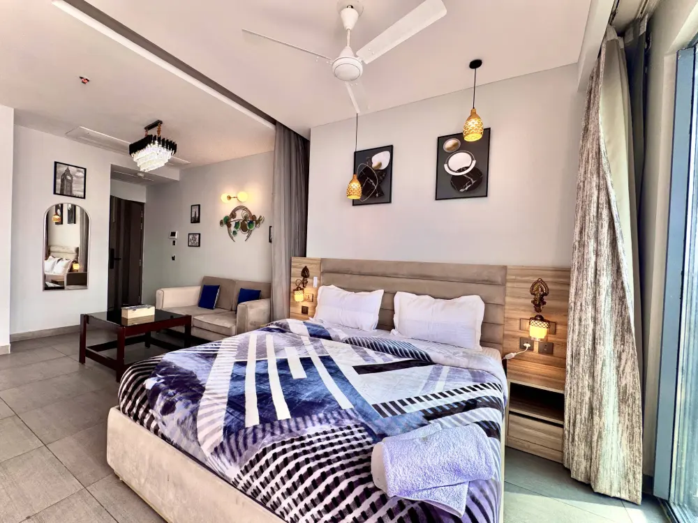 Stylish bedroom with blue accents at Mulberry Homes Supernova Spira Noida