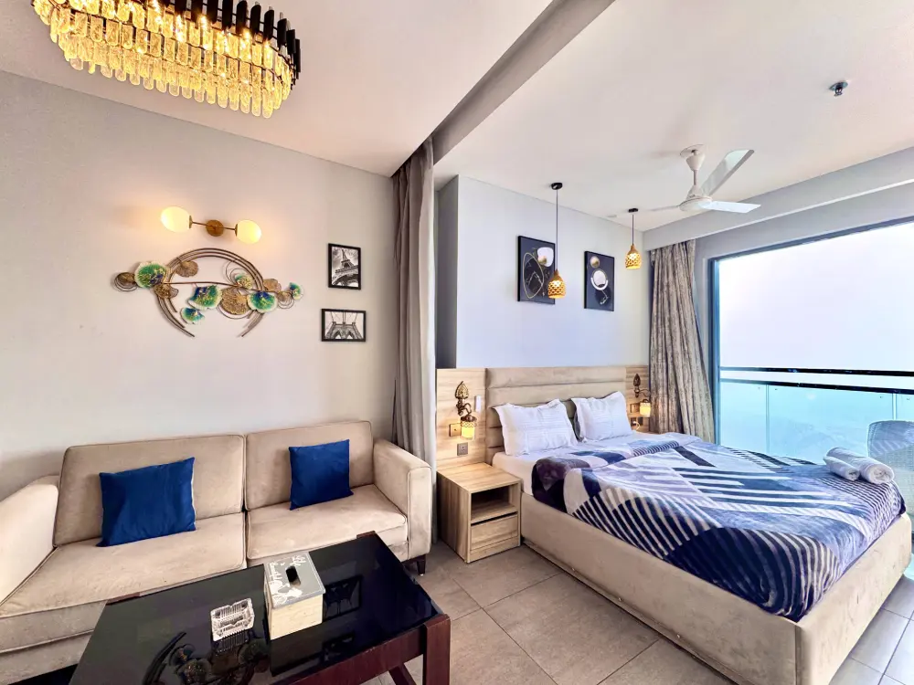Blue-themed luxury bedroom at Mulberry Homes Sector 94 Noida