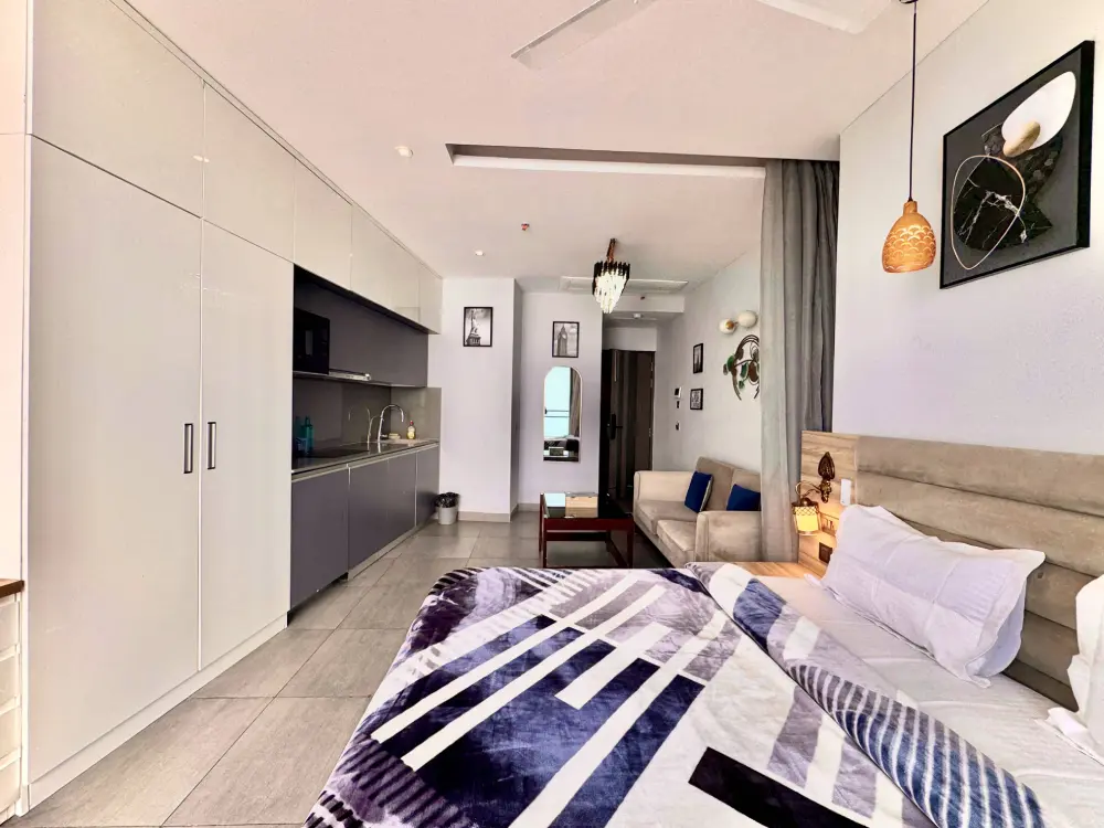 Spacious bedroom with city view at Mulberry Homes Supernova Noida