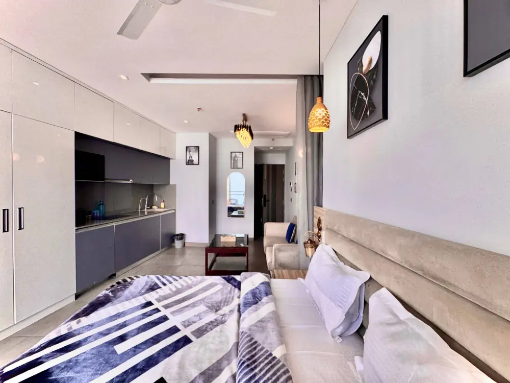 Living area in high-rise apartment at Mulberry Homes Noida