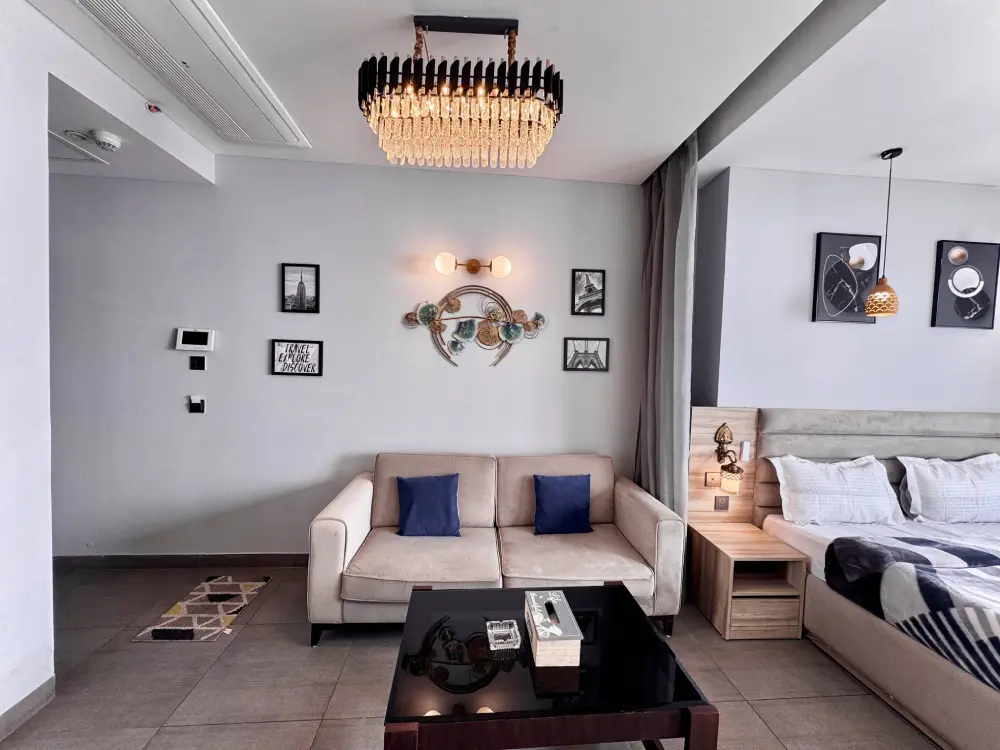 Elegant room with chandelier lighting at Mulberry Homes Supernova Noida