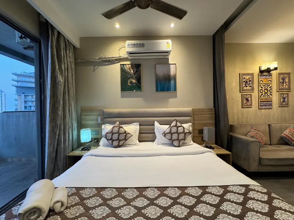 Luxury bedroom in high-rise apartment at Mulberry Homes Supernova Noida