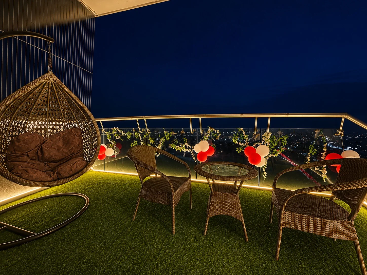 Balcony with balloon decor and night view at SkyRiver 43, floor 43 of Supernova Spira, Noida