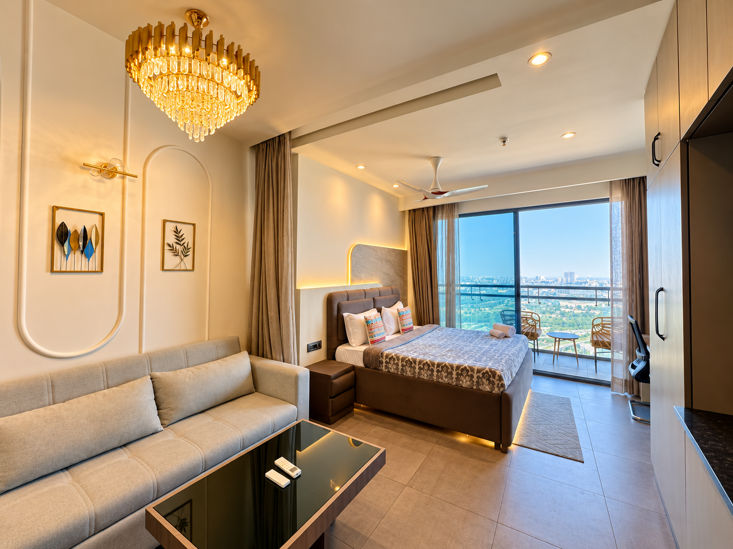 Panorama Balcony 32 service apartment in Noida, sofa bed and rattan balcony with river and city view, Supernova Spira Sector 94