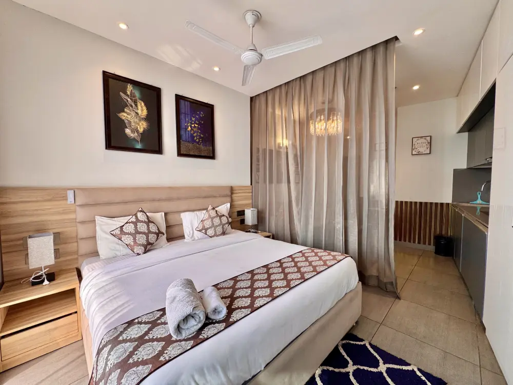 Luxury bedroom white premium linen RiverCrest 39 Supernova Spira Noida