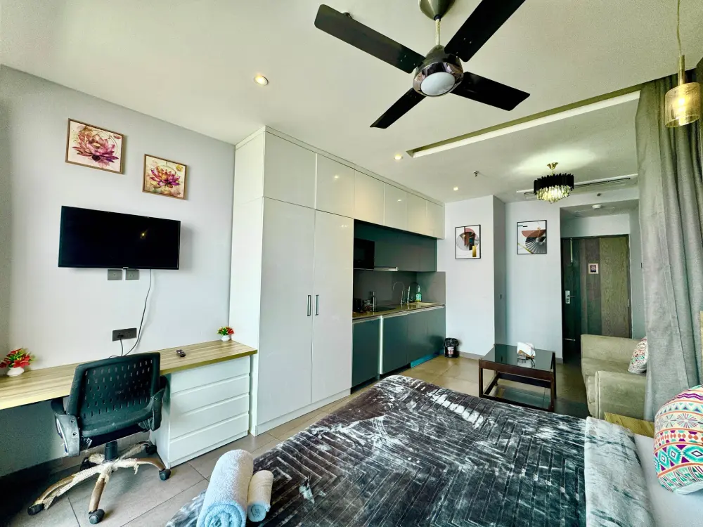 Bedroom with ceiling fan at CityGlow 28 Supernova 94 Noida