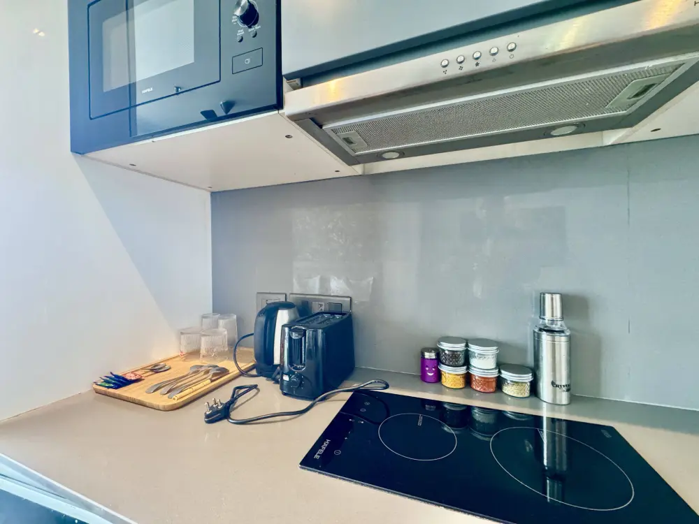 Bedroom with blue accent lighting at CityGlow 28 Supernova Spira Noida