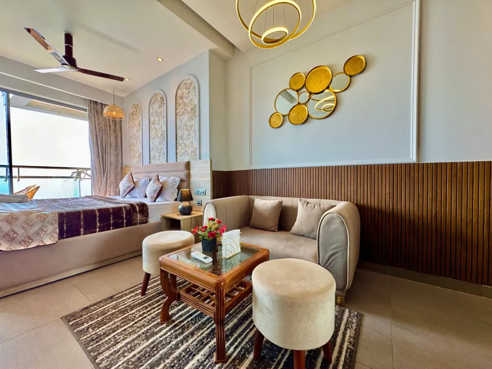Supernova Mulberry Noida – Eleve 31 dining area with solid wood dining table, cane chairs and pendant light, Sector 94