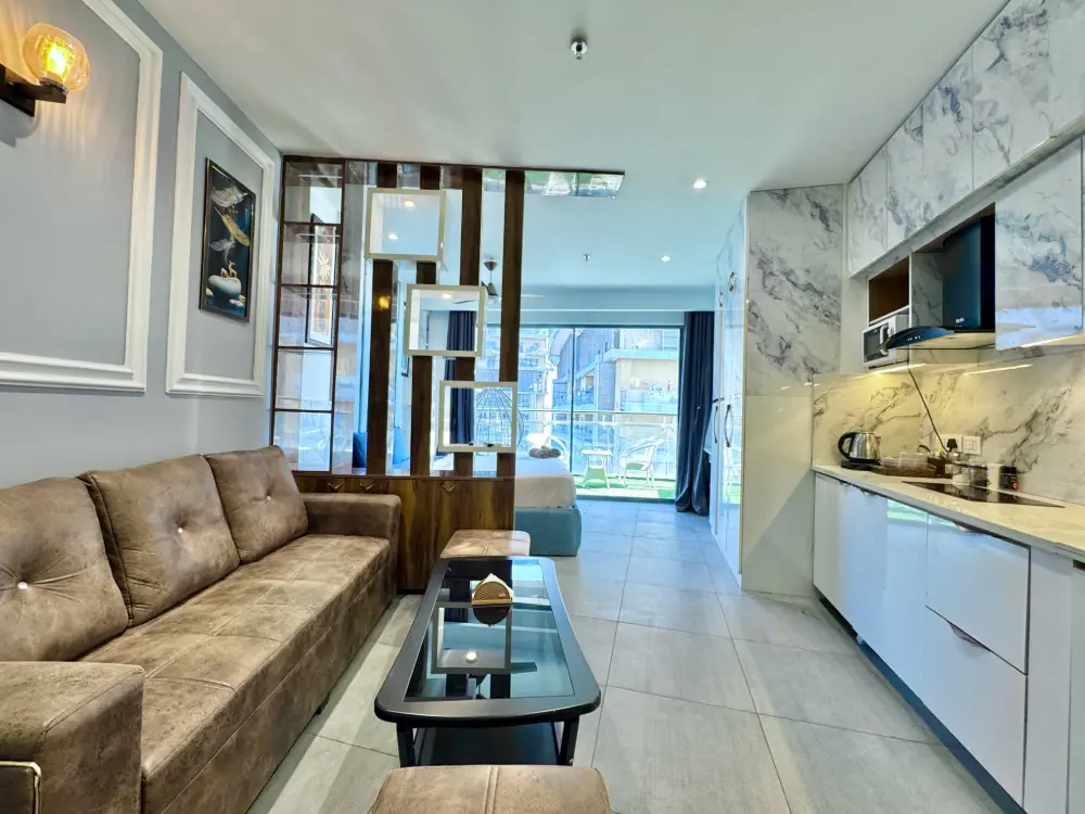 Open plan living and kitchen area at Mulberry Homes Supernova Noida