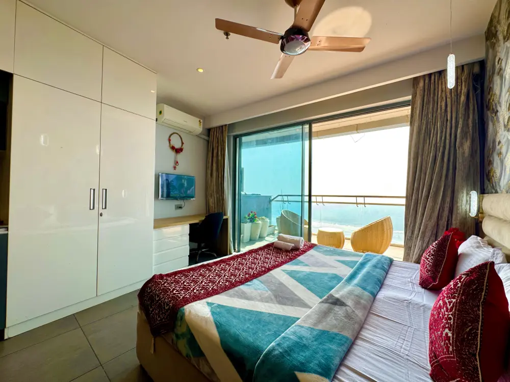 Bright bedroom with large window at Mulberry Homes Supernova Noida