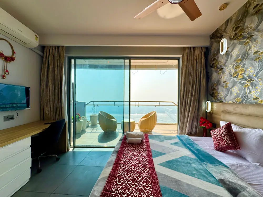 Bedroom with city view balcony at Mulberry Homes Supernova Spira Noida