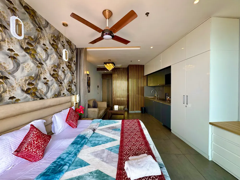 Bedroom with red cushions at Mulberry Homes Supernova Noida