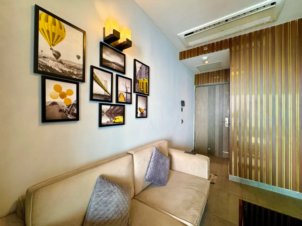 Living room with curtains at Mulberry Homes Supernova Noida