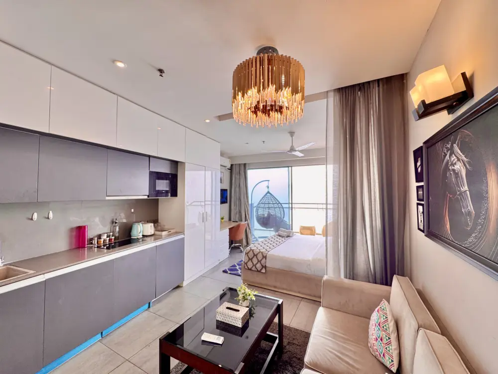 Supernova Spira stay bright white bedroom at luxury apartment Noida