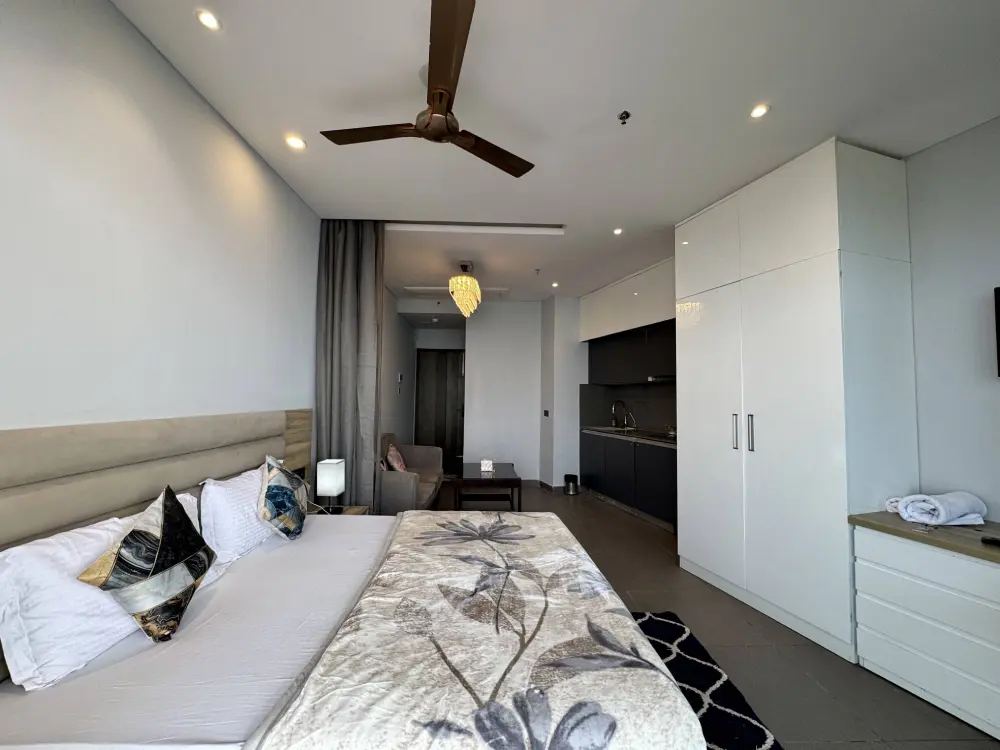 high-rise apartment bedroom with ceiling fan at Supernova Spira Noida