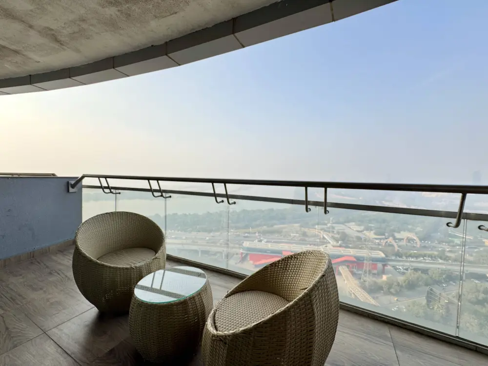 outdoor balcony seating with Yamuna river view at Mulberry Homes Noida