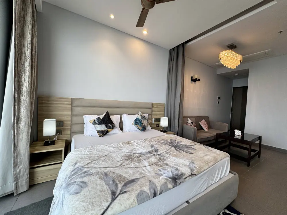 spacious bedroom with modern decor at Mulberry Homes Noida