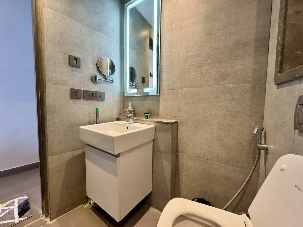 vanity and bathroom area at Mulberry Homes Noida