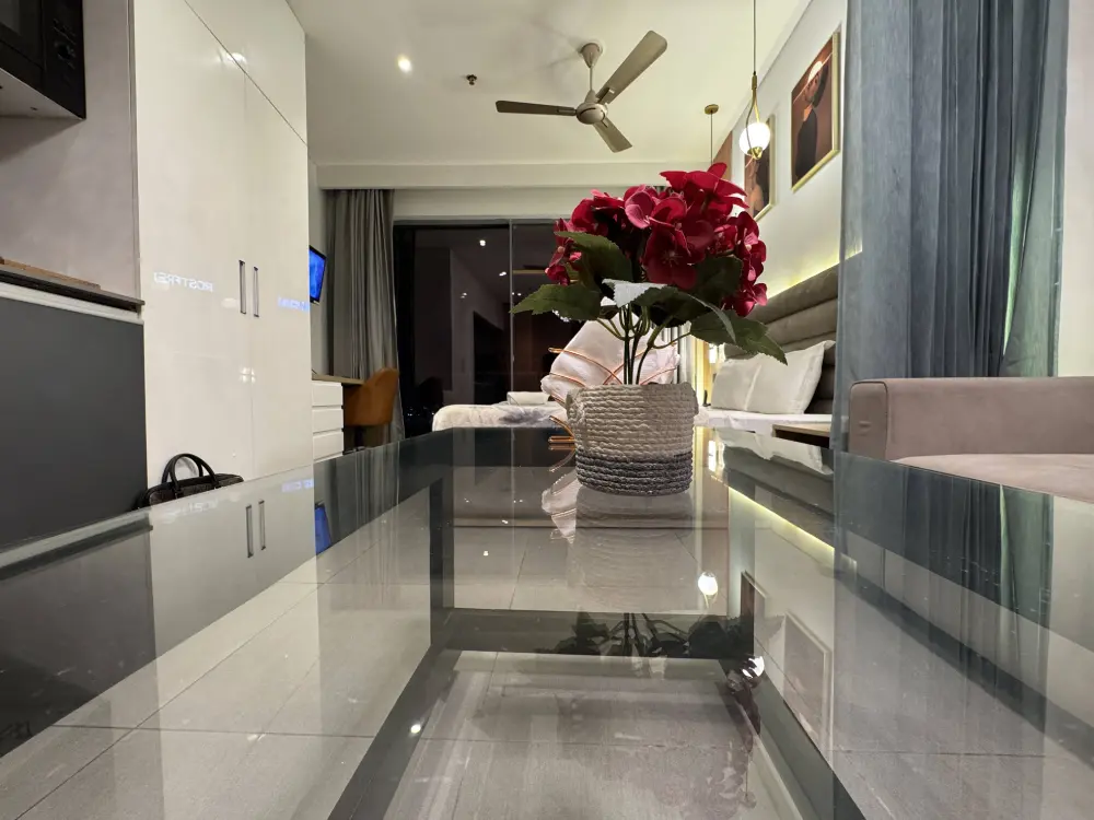 celebration decor with roses in bedroom at Mulberry Homes Supernova Noida