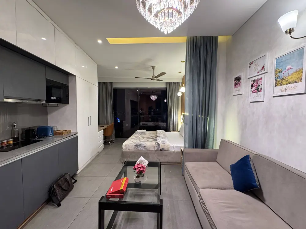 cozy living room in high-rise apartment at Mulberry Homes Noida