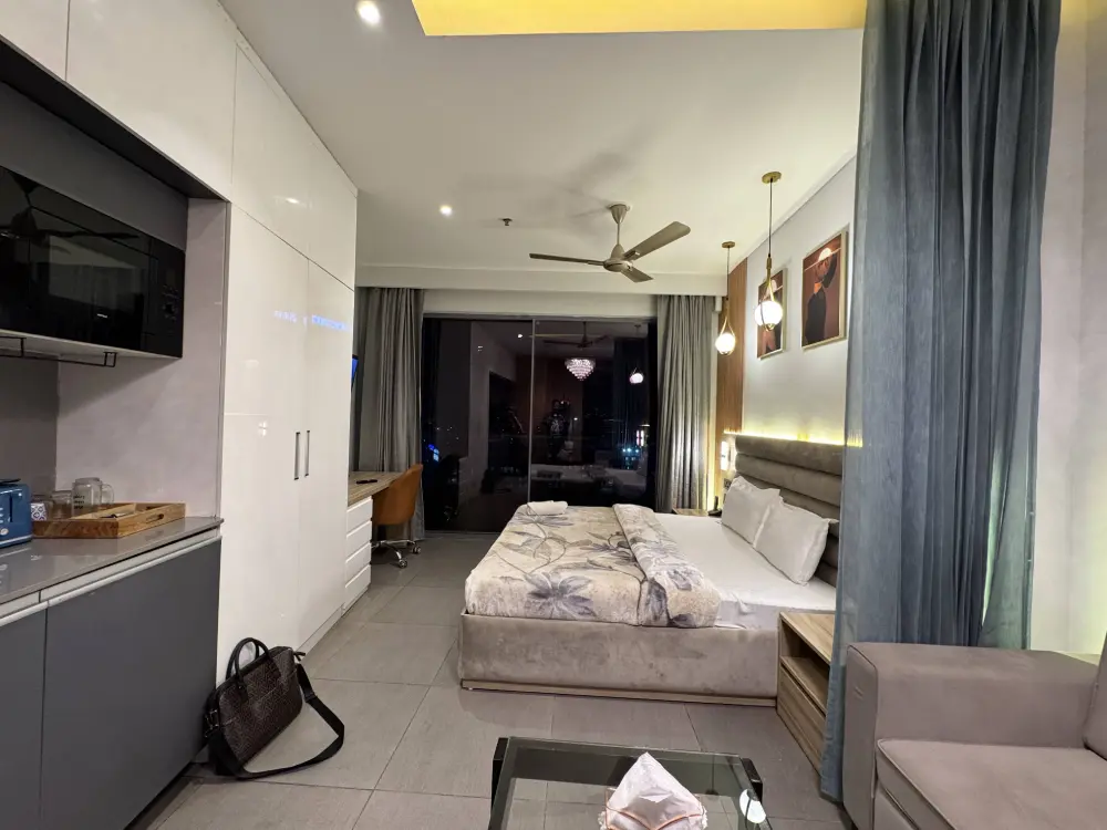 luxury room with seating area at Mulberry Homes Supernova Noida