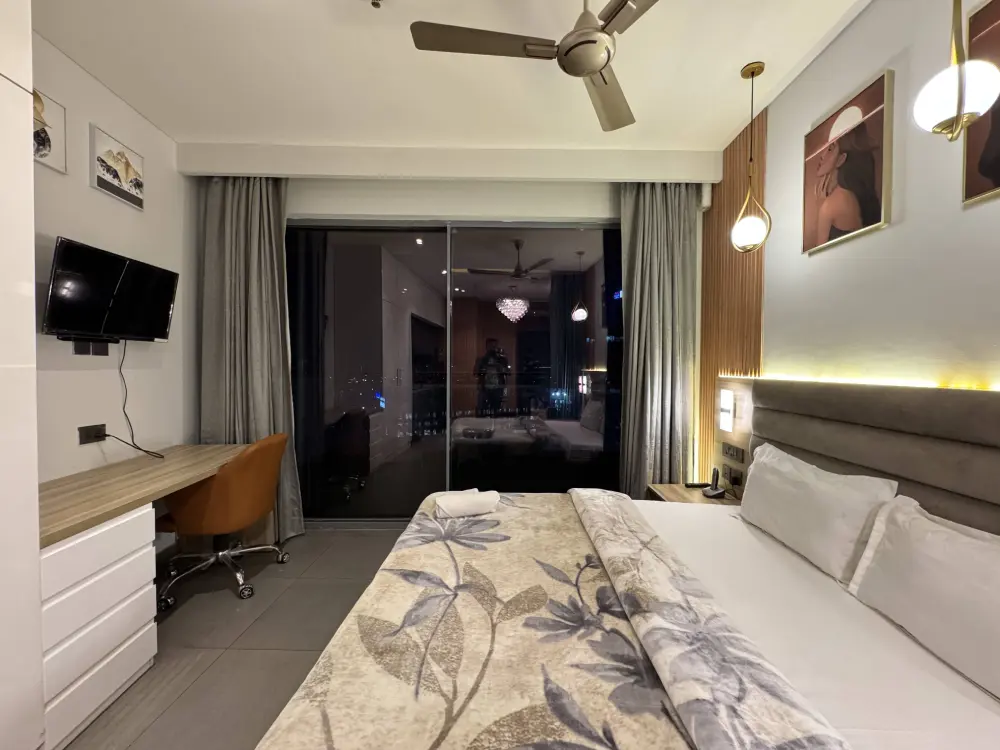 modern bedroom with TV unit at Supernova Spira Mulberry Homes Noida